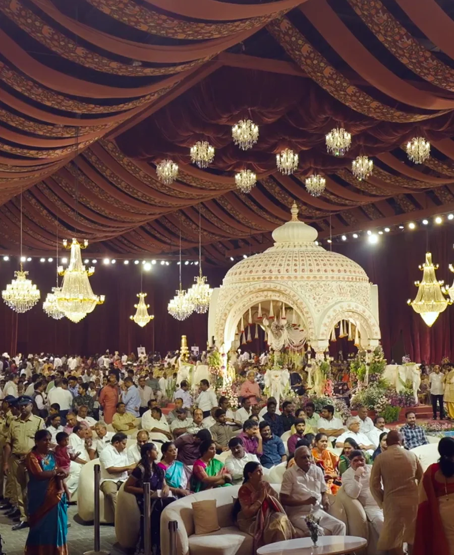 Wedding ceremony at Eventara with chandeliers and draped fabric ceiling